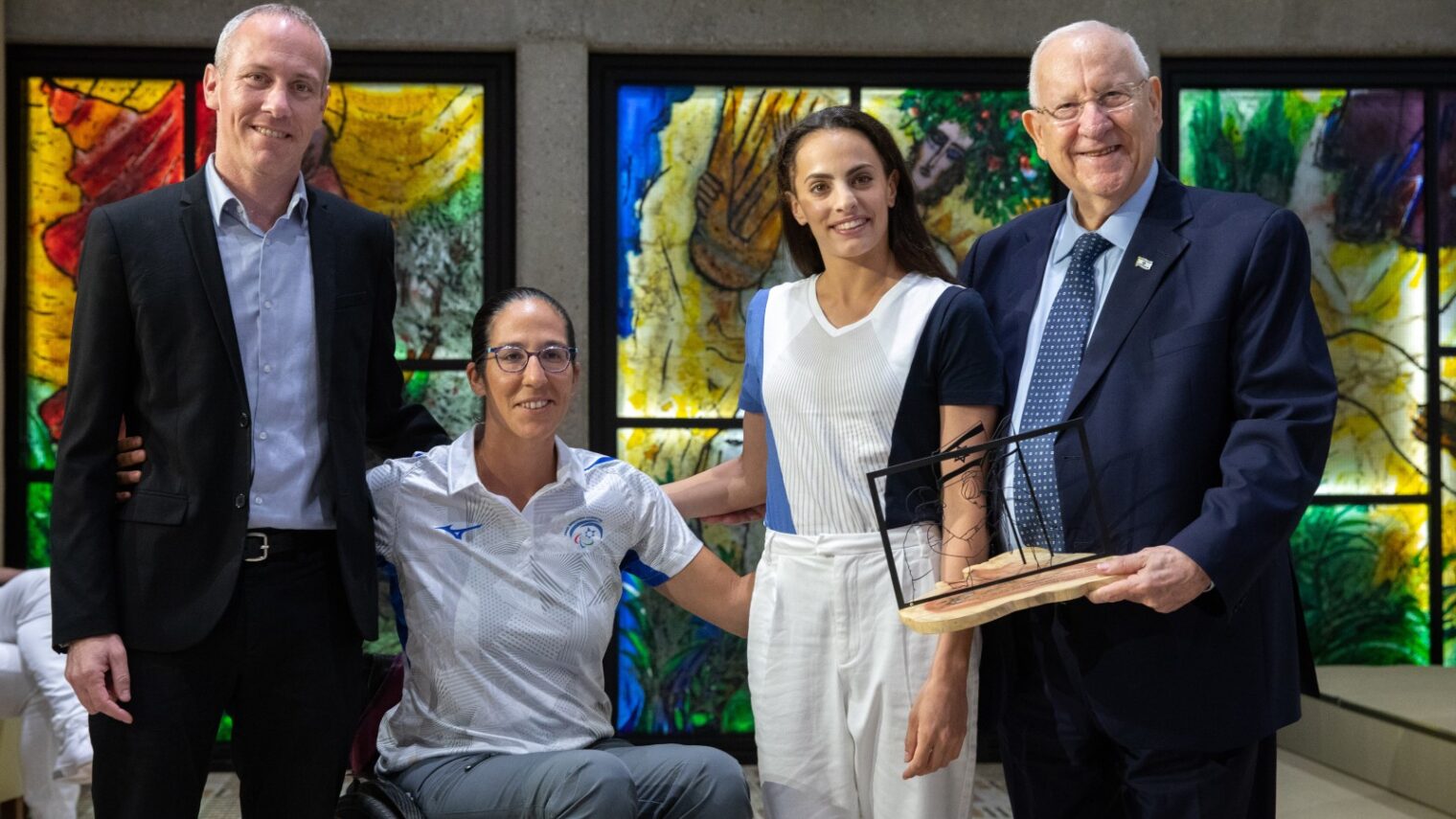Paralympic rower Moran Samuel and Olympic rhythmic gymnast Linoy Ashram, two of Israel’s leading medal contenders for the Tokyo Games, with Minister of Culture and Sports Hili Tropper and former Israeli President Reuven Rivlin at the President's Residence in Jerusalem on June 23, 2021. Photo by Olivier Fitoussi/Flash90