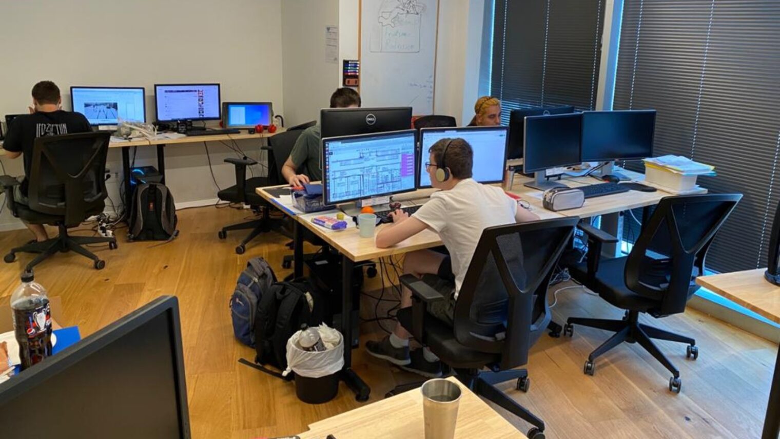 Employees of Point.AI at their workstations. Photo courtesy of Point.AI