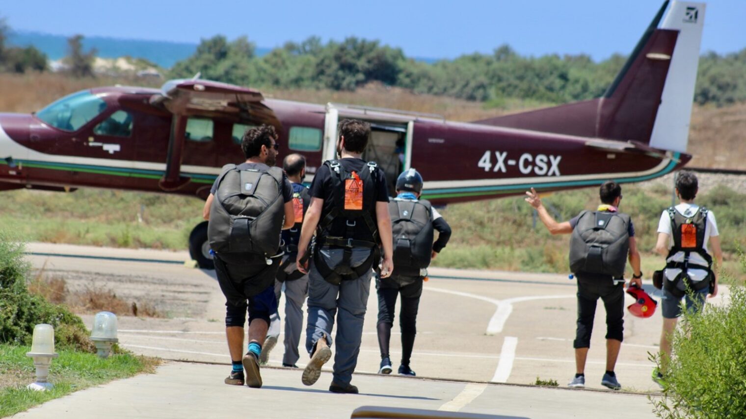 Skydivers at Paradive heading to the plane. Photo by Merav Blum