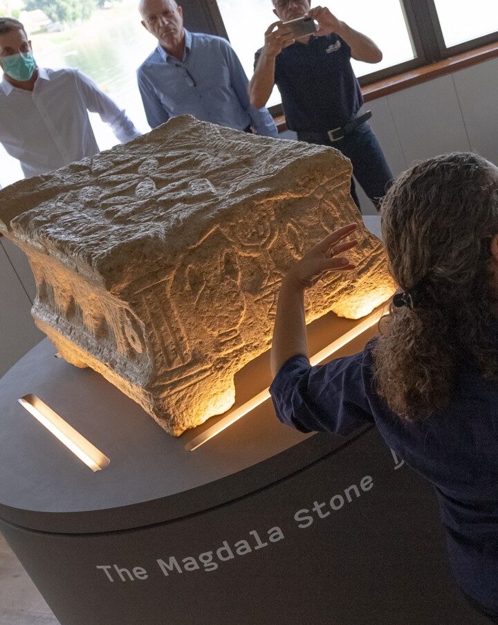 Dr. Einat Ambar Armon, curator of the Sanhedrin Trail exhibition on behalf of the Israel Antiquities Authority, presenting the Magdala Stone. Photo by Yair Amitzur/Israel Antiquities Authority