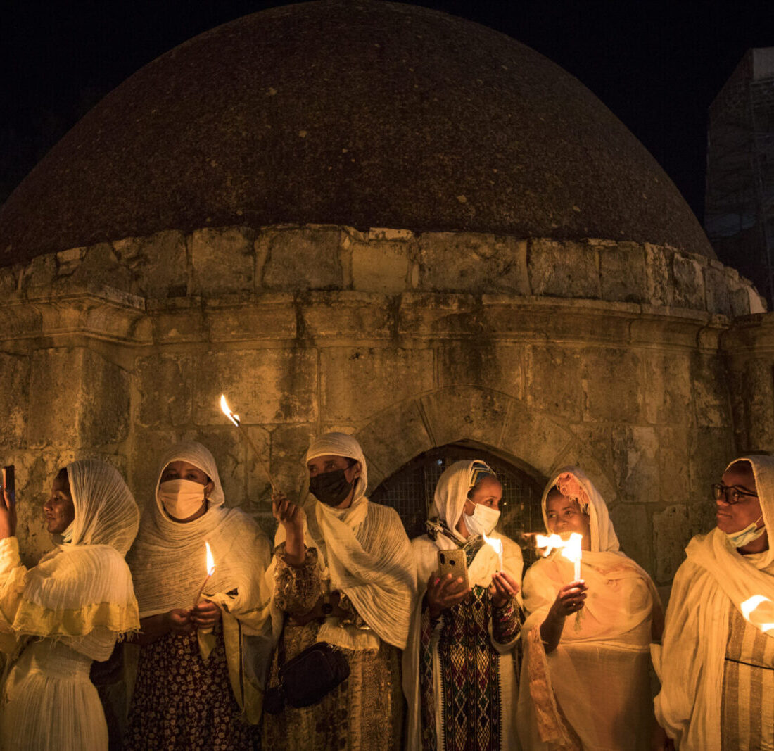 Ethiopian Orthodox Christian worshippers hold candles outside Deir Al-Sultan in the Church of the Holy Sepulchre during the ceremony of the Holy Fire in Jerusalem's Old City, Saturday, May 1, 2021. Photo by Olivier Fitoussi/Flash90