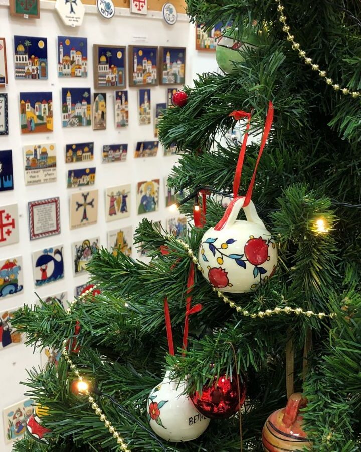 Unique Armenian tiles hang ready by a Christmas tree decorated with handmade ornaments at Hagop Karakashian’s store in Jerusalem’s Old City. Photo courtesy of Hagop and Tzoghig Karakashian