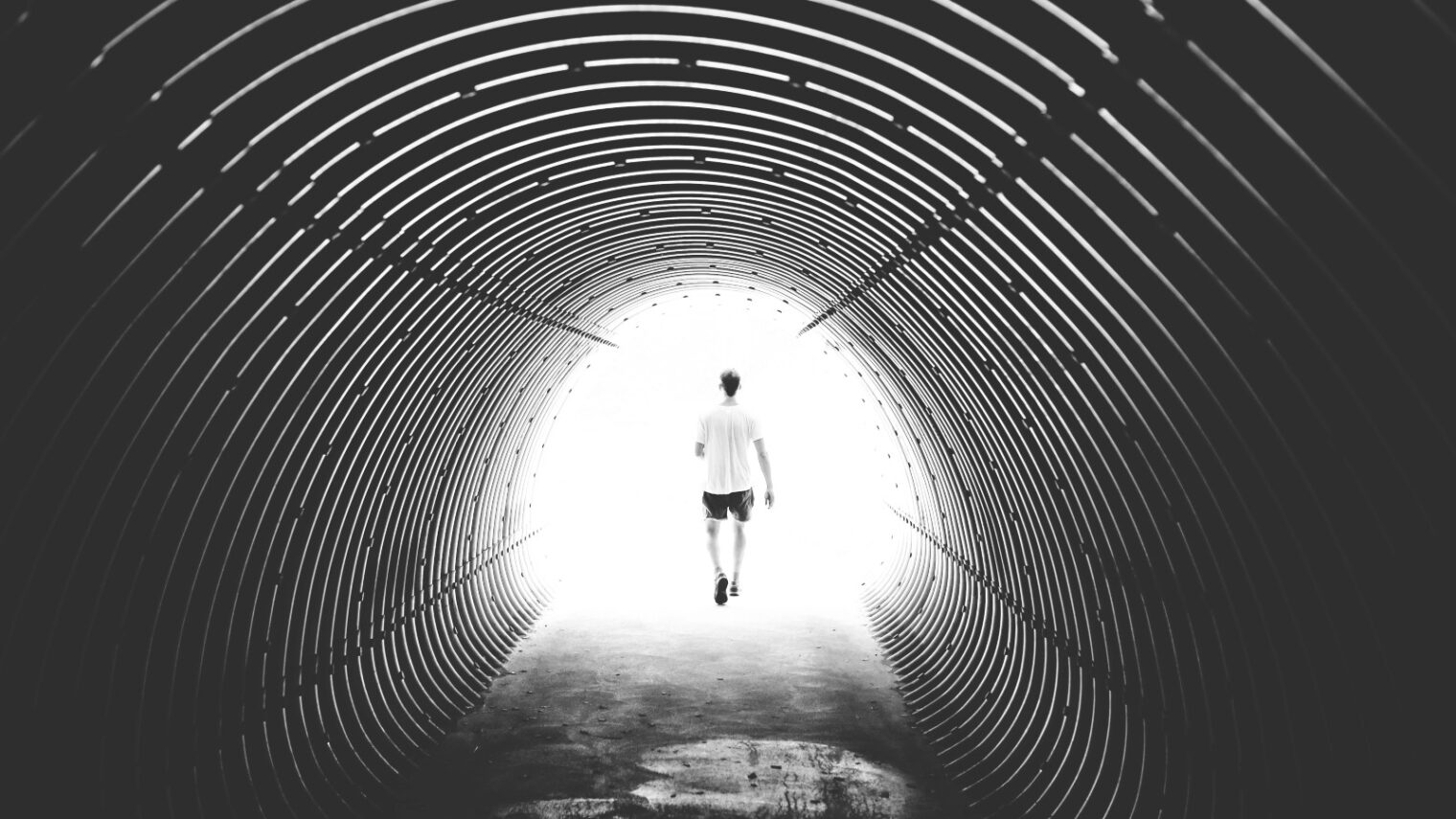 Is Omicron the light at the end of the tunnel? Photo by Kasuma from Pexels
