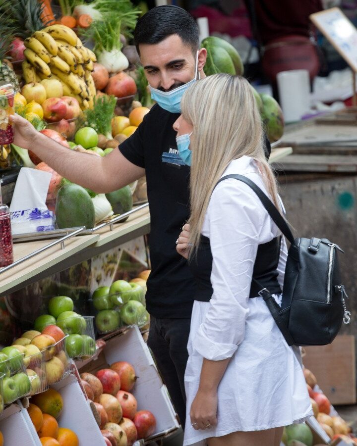 A shopper at Carmel Market in Tel Aviv. Photo by Miriam Alster/FLASH90