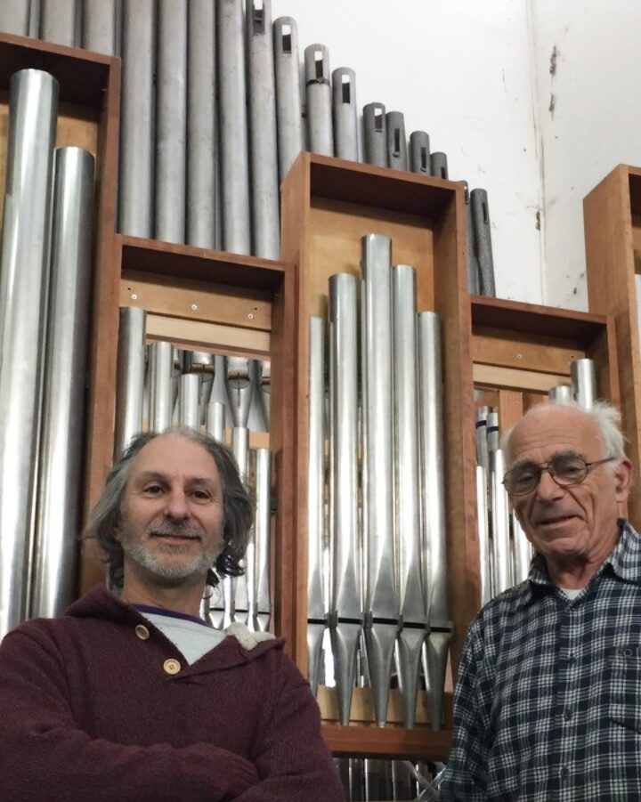 Uri Shani, left, and Gideon Shamir in front of organ pipes they will restore. Photo by Diana Bletter