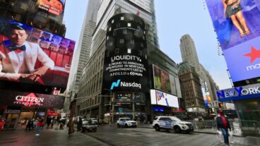 Liquidity deal announcement on the Nasdaq board in Times Square. Photo courtesy of Liquidity