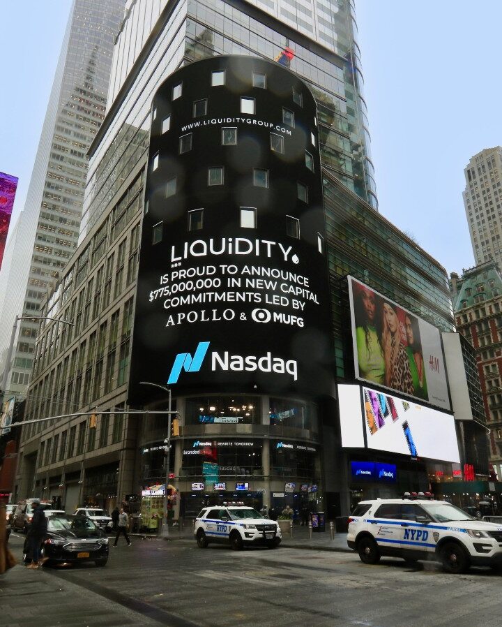 Liquidity deal announcement on the Nasdaq board in Times Square. Photo courtesy of Liquidity