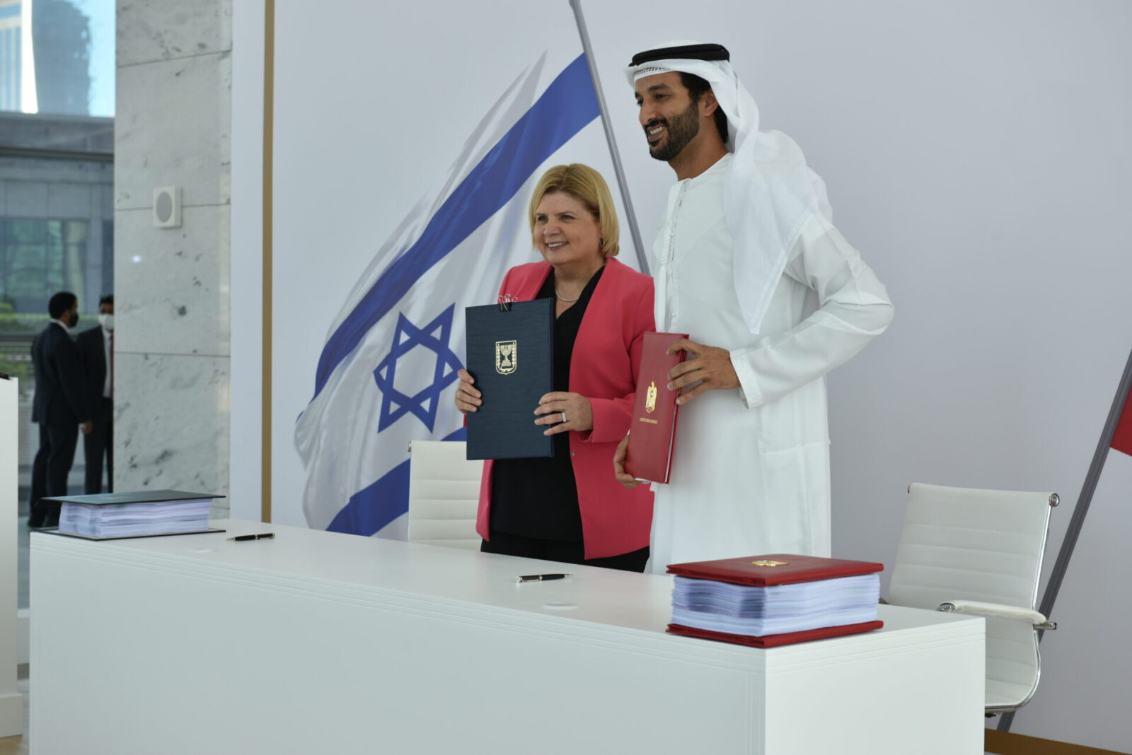 Israel’s Economy and Industry Minister Orna Barbivau and her counterpart, UAE Minister of Economy Abdulla bin Touq Al Marri sign the historic free trade agreement in Dubai. Photo by Anuj Taylor, Strap Studios
