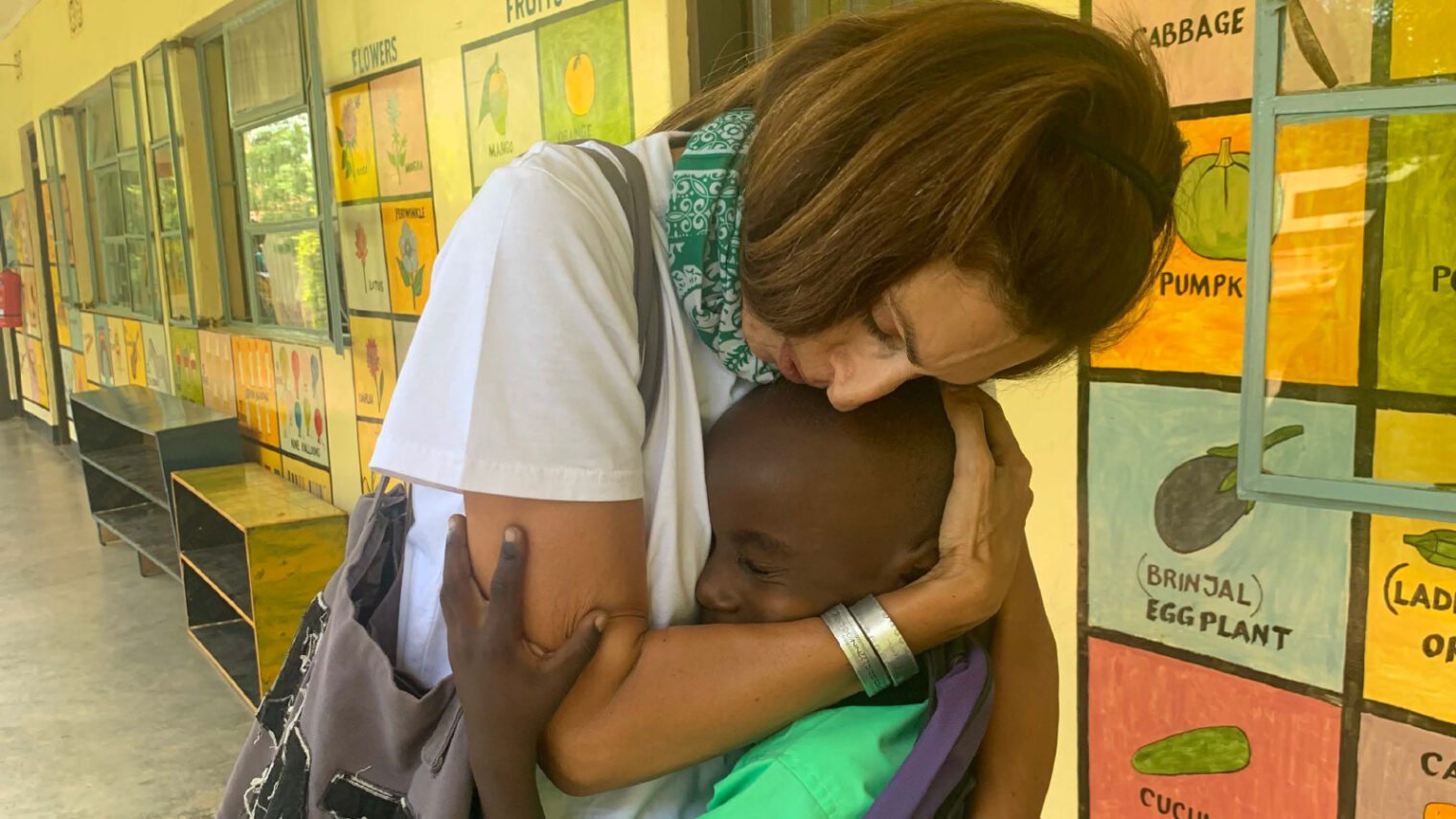 Ayelet Israeli, CEO of HalevAfrica, hugging a kindergartner at a preschool for orphans and children from poor families in the village of Tsamaka in northern Tanzania. Photo by Wilson/HalevAfrica