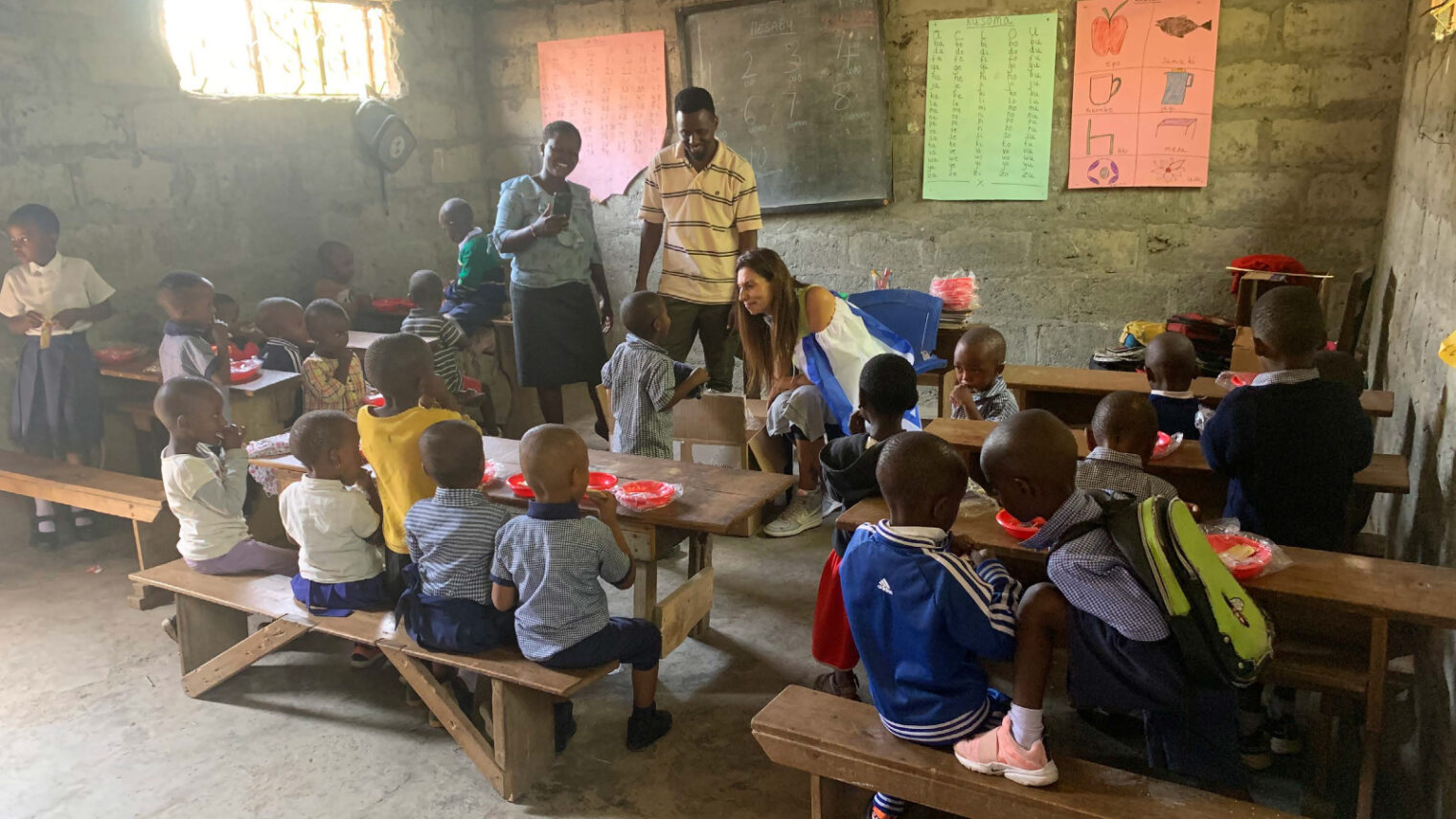 Ayelet Israeli, CEO of HalevAfrica, at a preschool for orphans and children from poor families in the village of Tsamaka in northern Tanzania. They’ve just received donated clothes and toys shipped for free by HalevAfrica partner Africa & More. Photo by Wilson/HalevAfrica