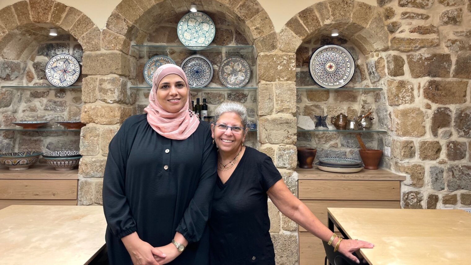 Manar Kordi, left, with Cathy Raff in the kitchen of Beit Elfarasha. Photo by Diana Bletter