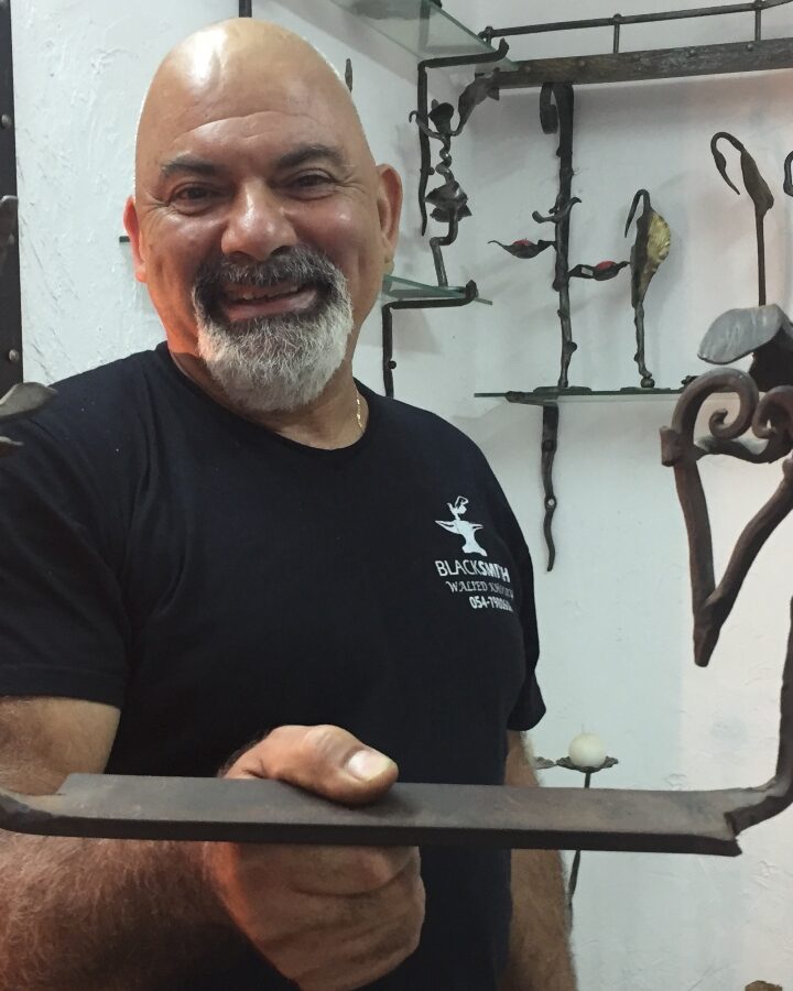 Blacksmith Walied Khoury with one of his sculptures. Photo by Diana Bletter