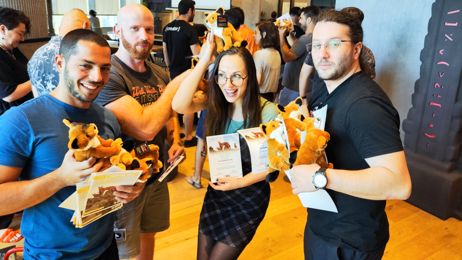 Overwolf employees were overjoyed with their wolf adoption certificates and plush wolves. Photo courtesy of Overwolf