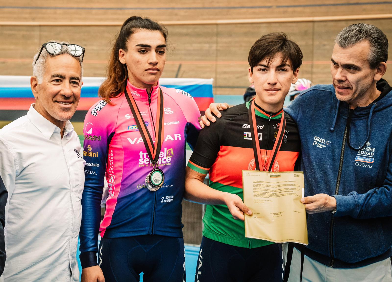 Sylvan Adams, left, congratulating Zarifa Hussaini, contestant in the Afghan national cycling championship held in exile in Switzerland. Photo by Noa Arnon