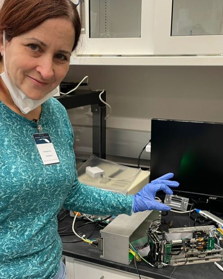 Prof. Sara Eyal with a miniaturized and remote control lab launched to the International Space Station in 2022. Photo by Emile Kan