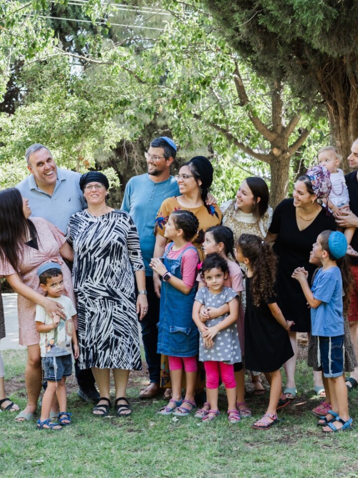 Kidney donor Rony Zigler, his wife Orit, surrounded by their children and grandchildren. Photo by Shai Ofek