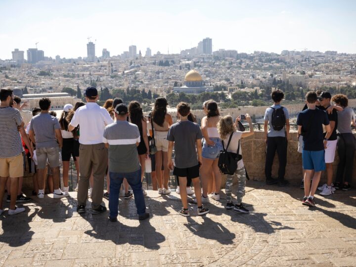 Tourists on the lookout point on the Mount of Olives in Jerusalem, July 12, 2022. Photo by Nati Shohat/Flash90