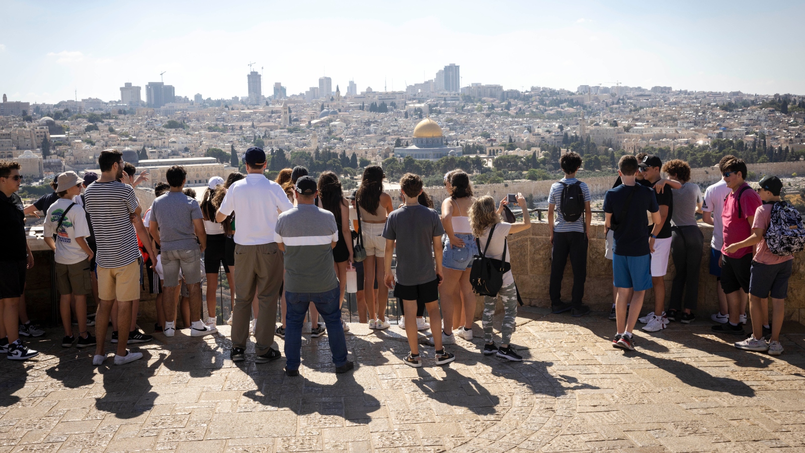 Tourists on the lookout point on the Mount of Olives in Jerusalem, July 12, 2022. Photo by Nati Shohat/Flash90