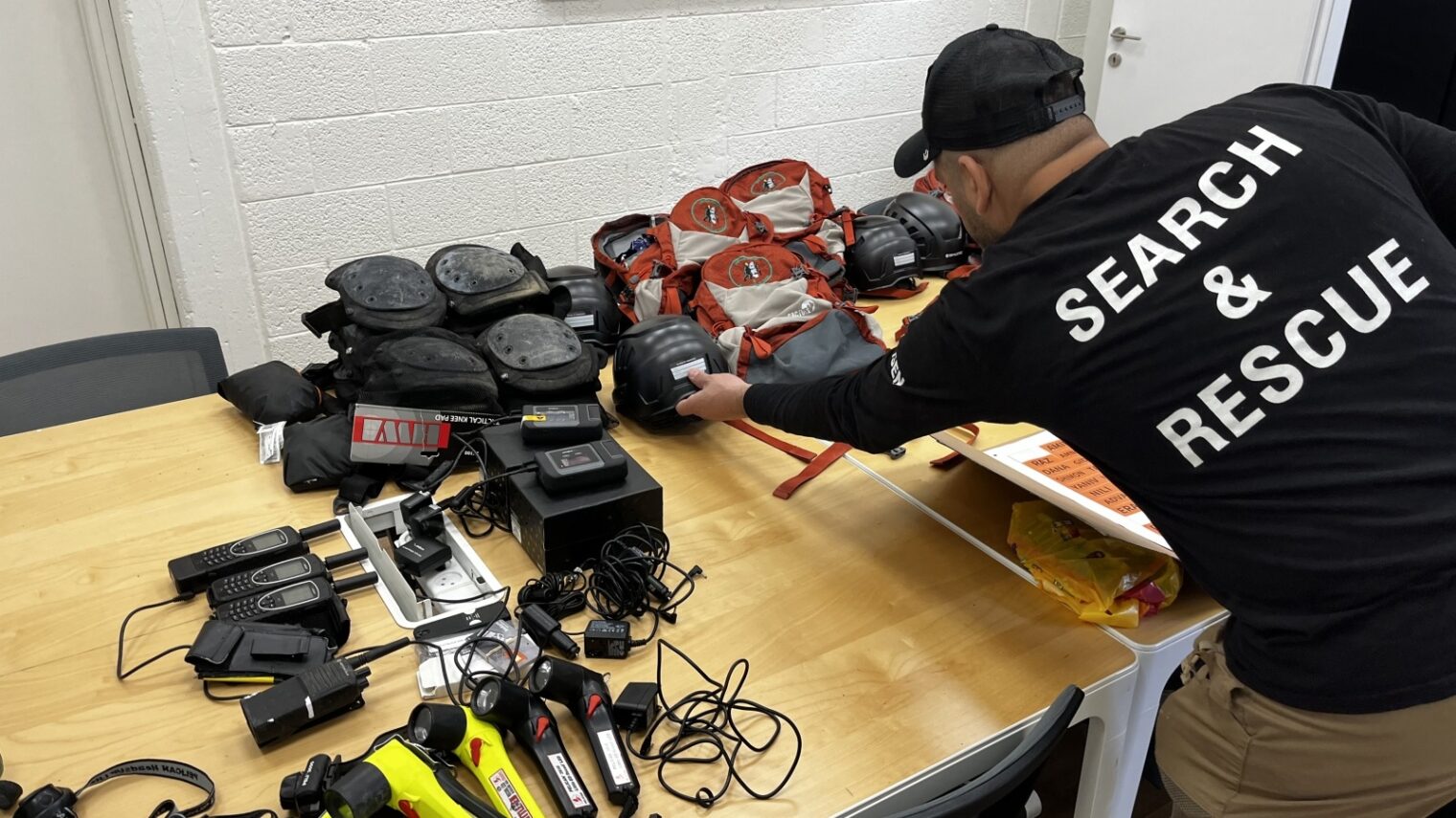 An Israeli rescue worker prepares equipment for today's mission to Turkey. Photo courtesy of SmartAID