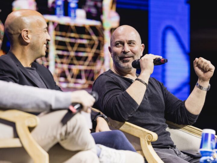 Lior Raz, right, and Avi Issacharoff speaking about their hit show, Fauda, at the OurCrowd Global Investor Summit in Jerusalem, February 15, 2023. Photo by Tomer Foltyn