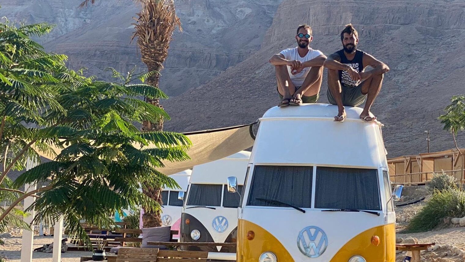 Business partners Ben Shukrun, left, and Avi Barkai with their camper vans. Photo courtesy of Ein Gedi Camp Lodge
