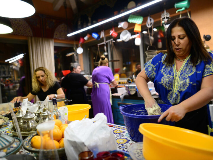 Members of the Turgeman Family prepare food at a Mimuna festival in Jaffa. Photo by Tomer Neuberg/Flash90