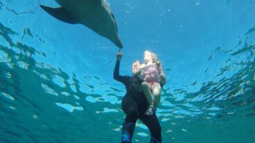 Sophie Donio working with a young client at the Dolphin Reef, Eilat. Photo by Hadas Tsion