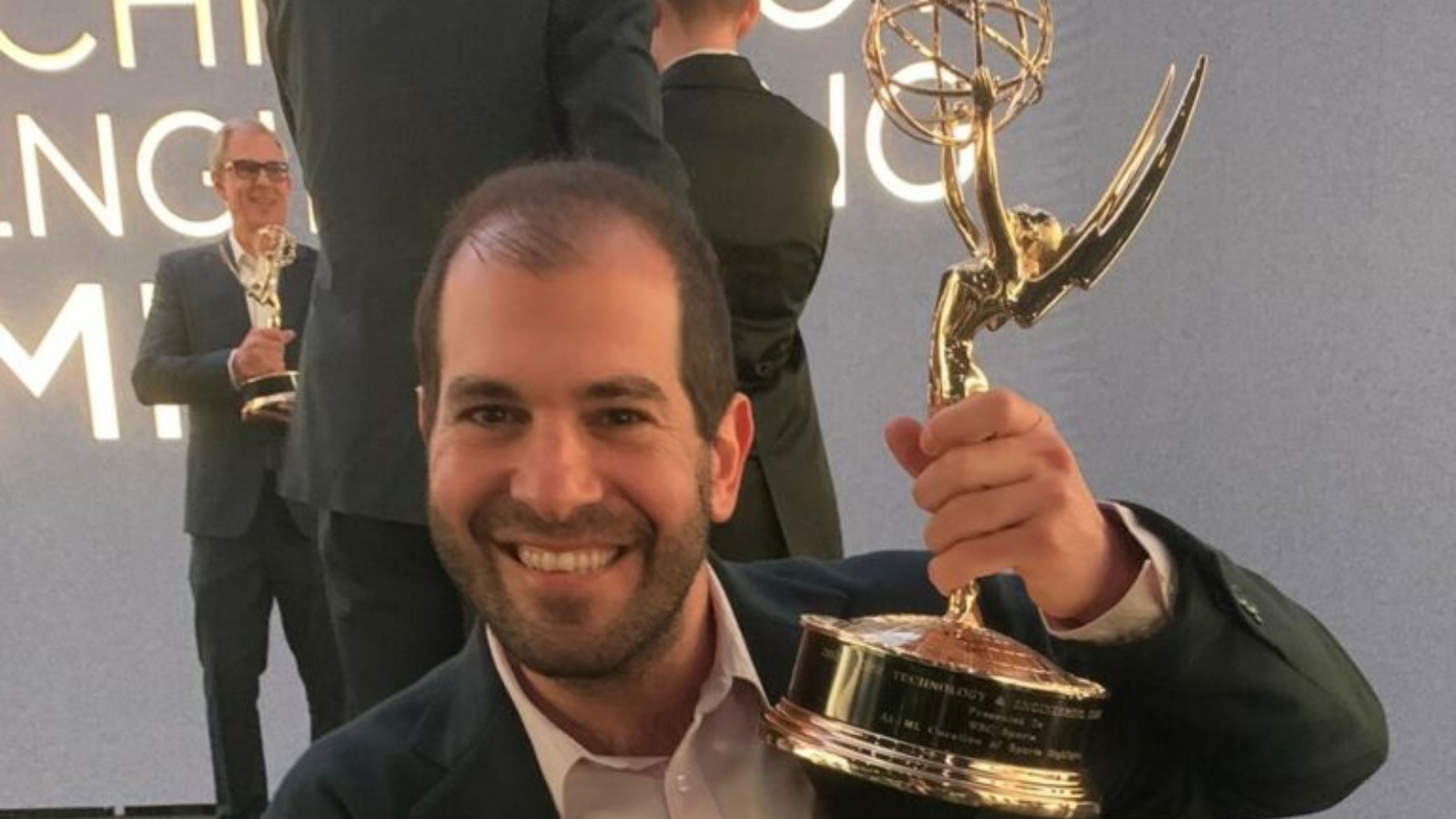 Aviv Arnon, cofounder and chief business development officer at WSC Sports, receiving the Emmy Award. Photo courtesy of WSC Sports