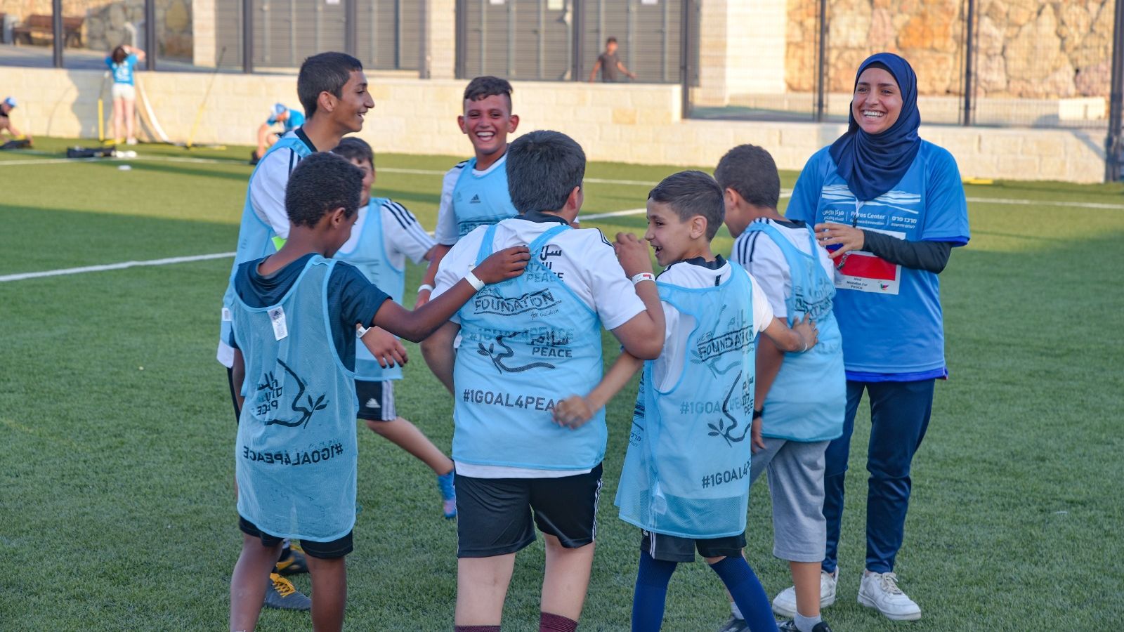 Children of Jewish and Arab heritage playing together at Sporting in the Service of Peace. Photo by Ilan Hadar