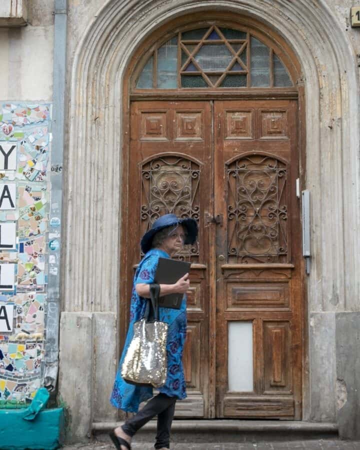 A woman walks by a street art mosaic on Nachalat Binyamin Street in Tel Aviv. Photo by Miriam Alster/FLASH90