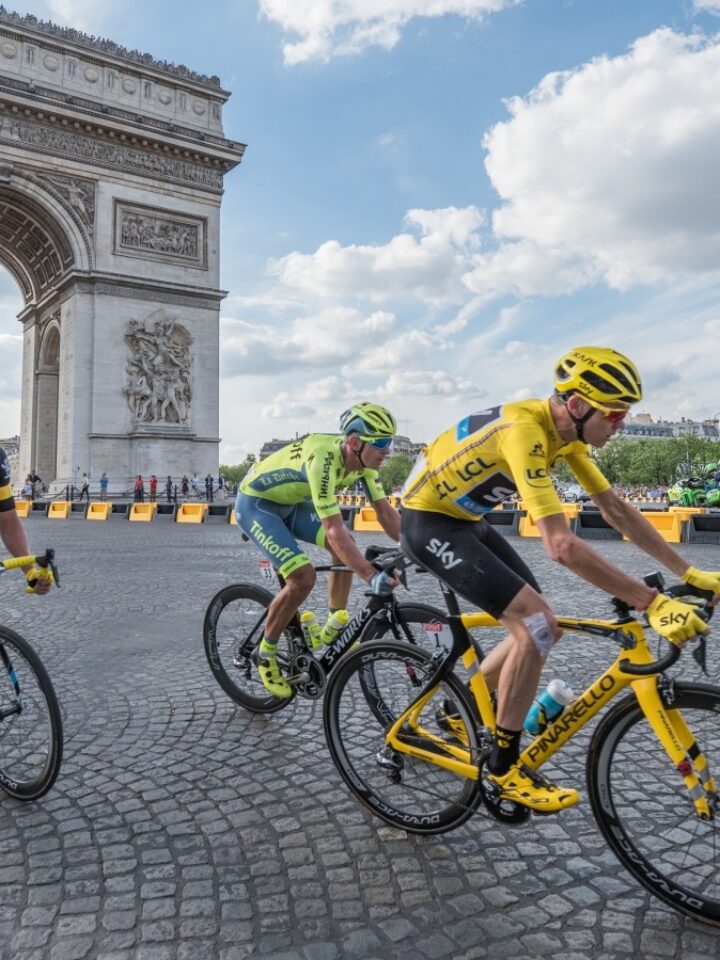 Christopher Froome, in yellow jersey, in front of Arc de Triomphe during the Tour de France 2016. Photo by Frederic Legrand via Shutterstock.com