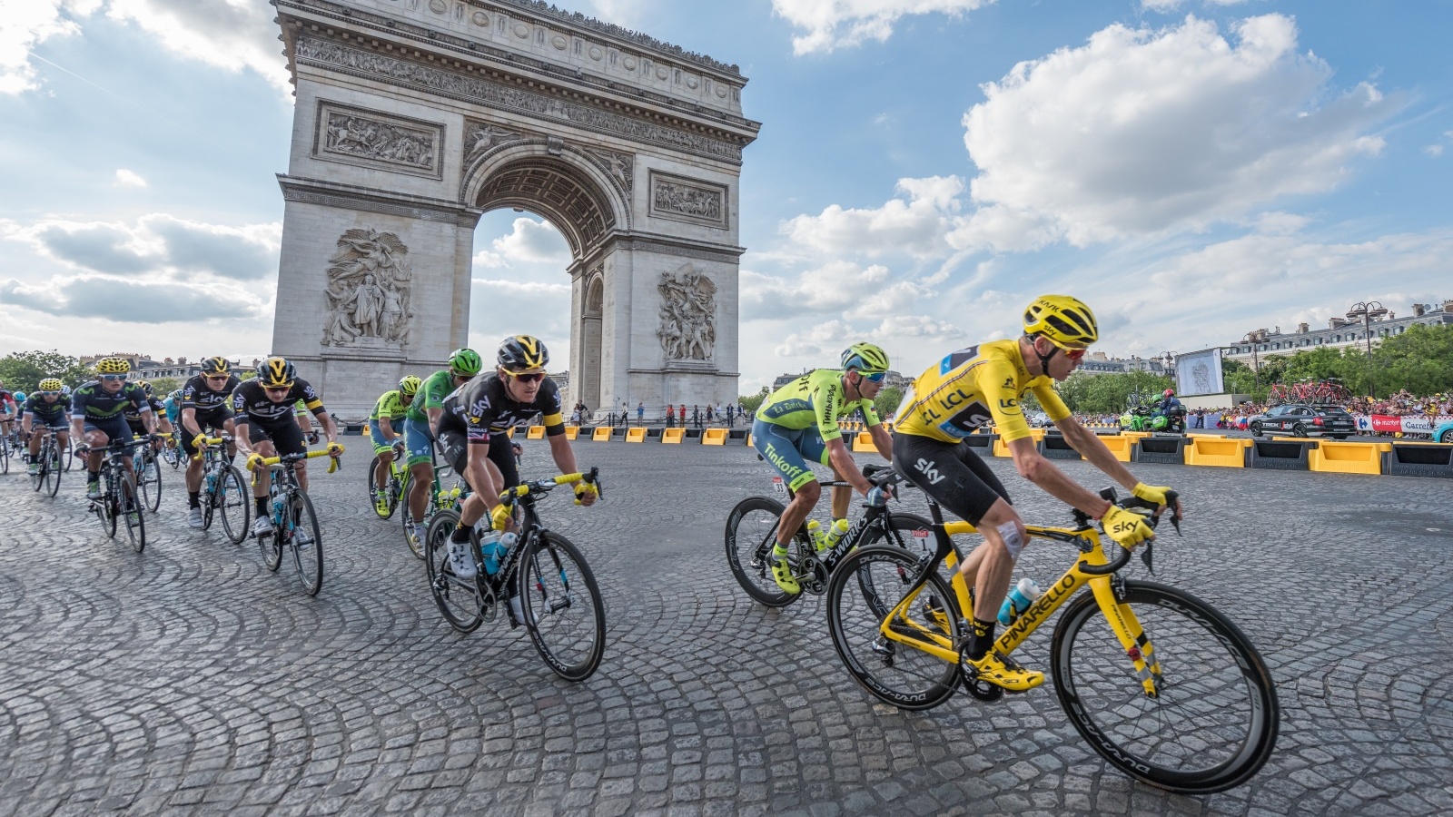Christopher Froome, in yellow jersey, in front of Arc de Triomphe during the Tour de France 2016. Photo by Frederic Legrand via Shutterstock.com