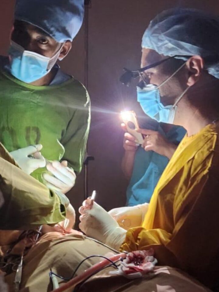 Performing surgery with smartphone flashlights in the operating room of St. Peter’s Hospital in Ethiopia. Photo courtesy of Dr. Vasila Rechea