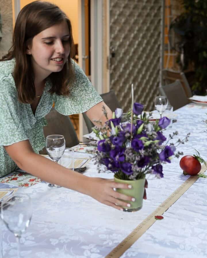 Getting the table ready for a large family celebration dinner on Rosh Hashana. Photo by Nati Shohat/Flash90