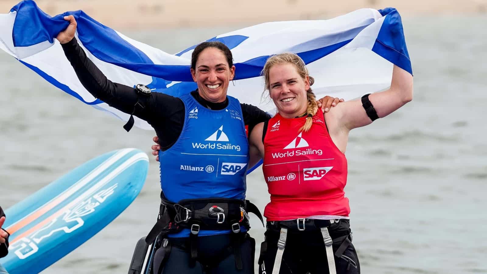 Gold medalist Shahar Tibi, left, and silver medalist Katy Spychakov celebrating at the Allianz World Championships in The Netherlands, August 2023. Photo by Sailing Energy/World Sailing.Credit: Sailing Energy / World Sailing.  19 August 2023.