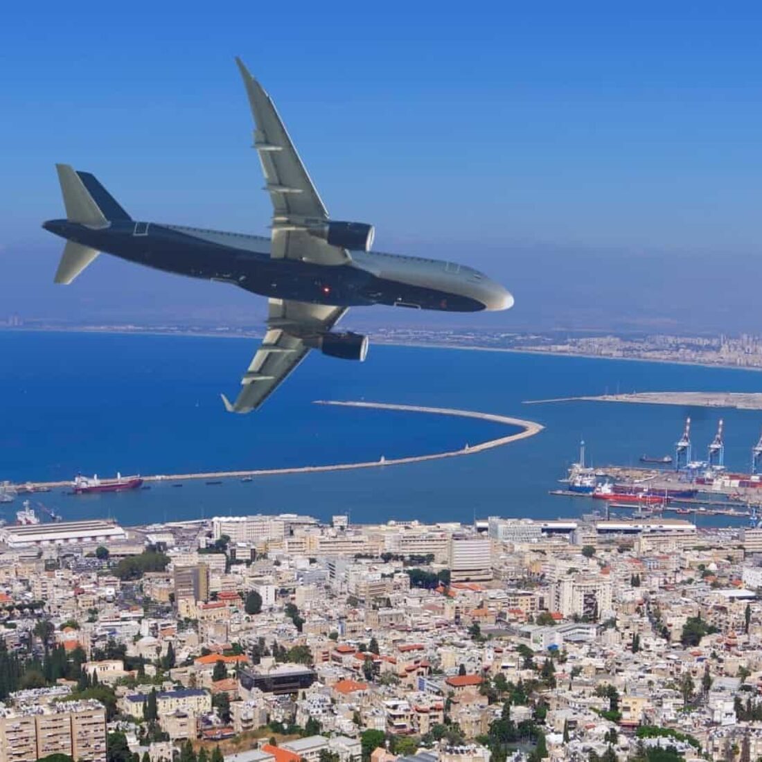 A plane flying over Haifa. Photo by Ana Kulagina via shutterstock.com