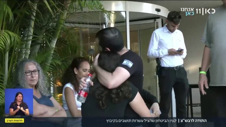 Elia Natan Lilintal with members of his kibbutz after the ordear was over. Photo: screenshot from KAN News