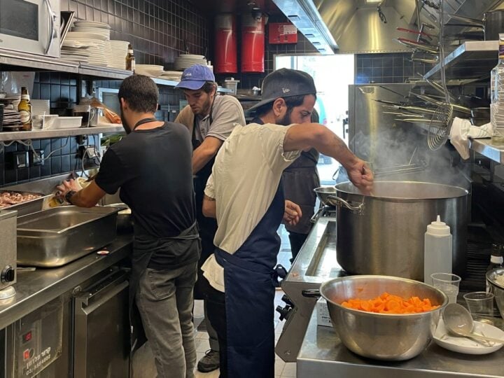 Chefs cooking up meals for soldiers and wounded or displaced civilians, at Asif Culinary Institute. Photo by Natalie Selvin