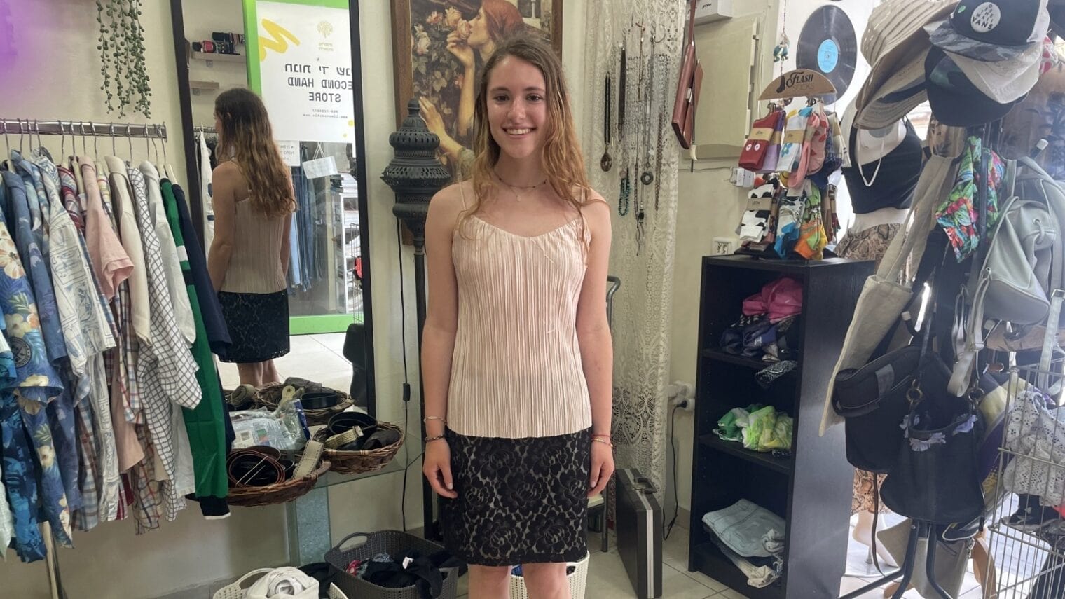 Rachel Fisher modeling an outfit at Limonada thrift shop. Photo by Jeanette Shine