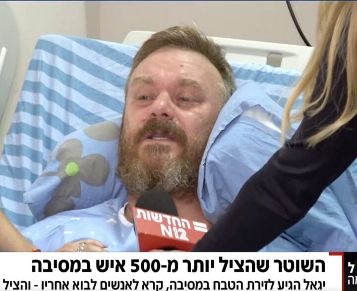 Policeman Yigal Singer speaking to reporters from his hospital bed. Screenshot from Channel 12 news Via X (Twitter) Shivam Kahar