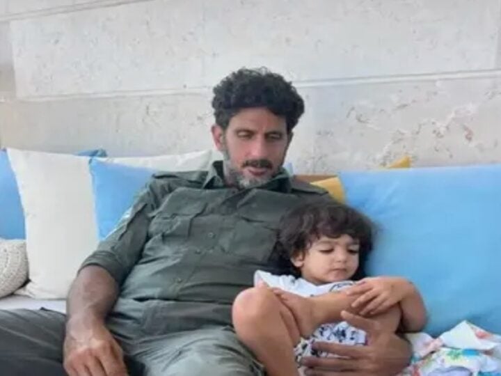 Fauda star Tsahi Halevi with his son wearing an Israeli army uniform. Photo courtesy of Lucy Aharish via Instagram