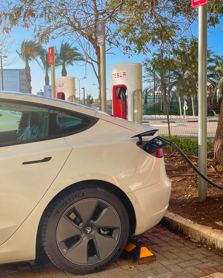 A Tesla charging at a Supercharger station. Photo by MagioreStock via Shutterstock.com