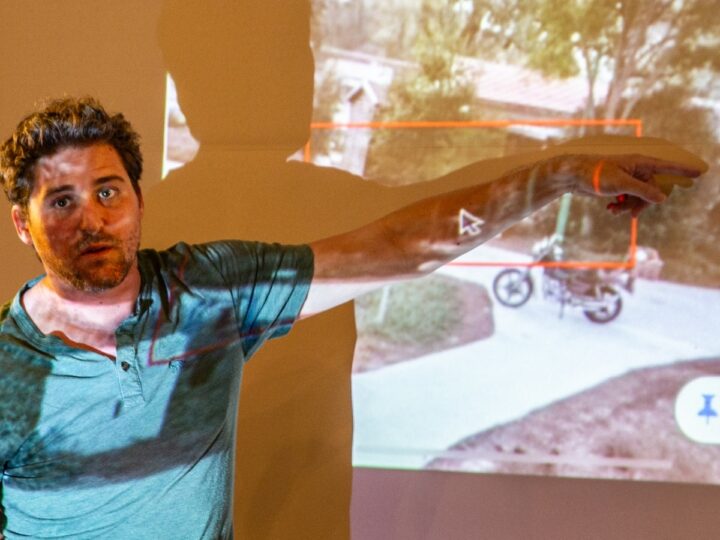 Eyal Barad showing a still from his CCTV camera showing a neighbor being abducted on a motorbike. Photo by John Jeffay