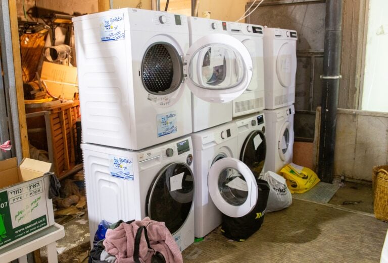 Washing machines for evacuees from Nir Oz at Isrotel Yam Suf hotel, Eilat. Photo by John Jeffay