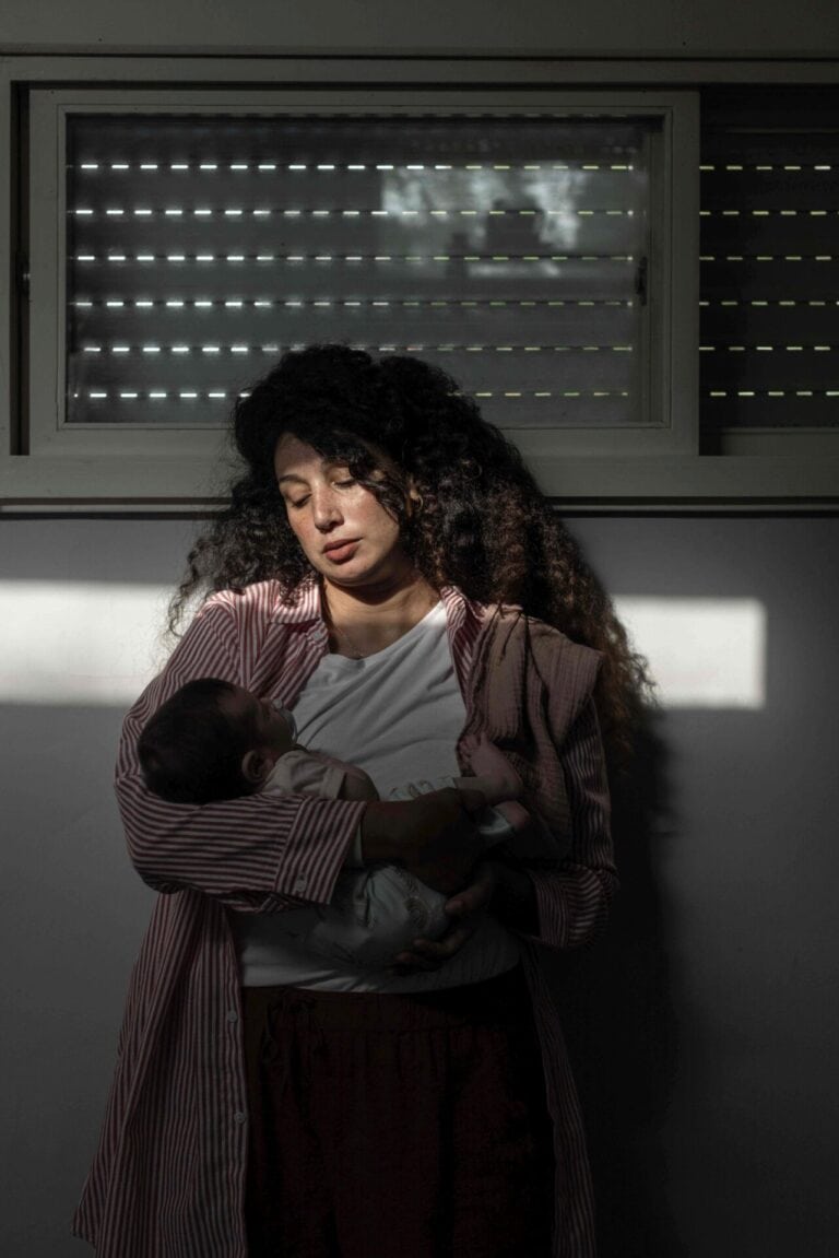 Shaylee Atary and her daughter Shaya, who survived the attack on Kibbutz Kfar Aza by fleeing from one hiding spot to another. Her husband, Yahav Winner, was considered a missing person for a few days, until his body was found. Avishag Shaar-Yashuv for The New York Times