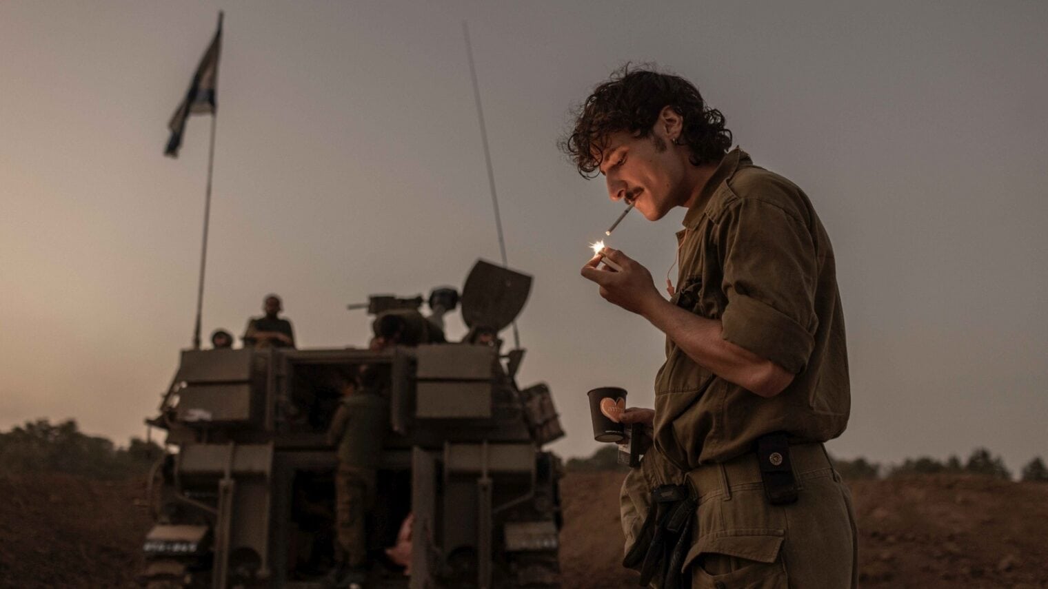 A soldier enjoys a break near the Gaza border. Avishag Shaar-Yashuv for The New York Times