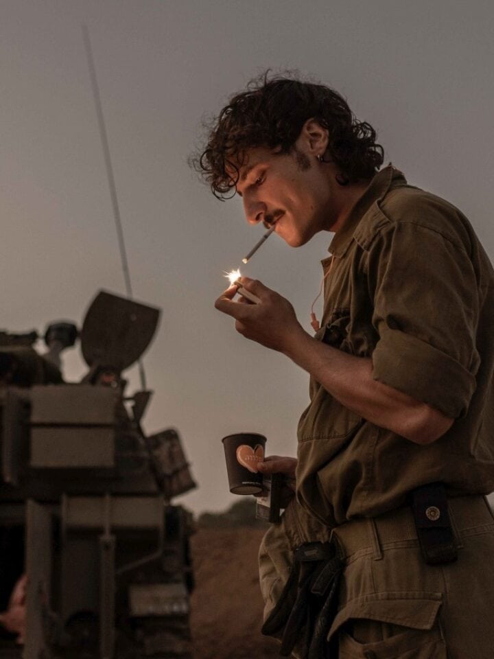 A soldier enjoys a break near the Gaza border. Avishag Shaar-Yashuv for The New York Times