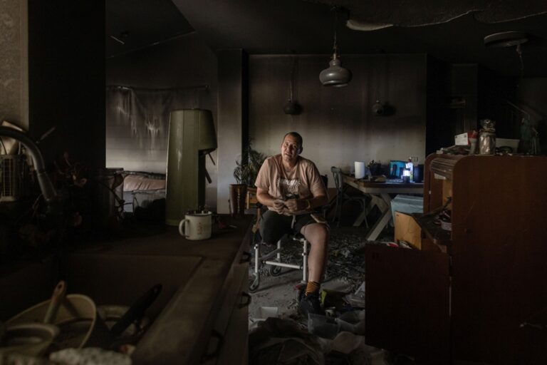 Avida Bachar sits among the ruins of his home in Kibbutz Beâ€™eri, where he lost his leg and where his wife and son were murdered. Avishag Shaar-Yashuv for The New York Times