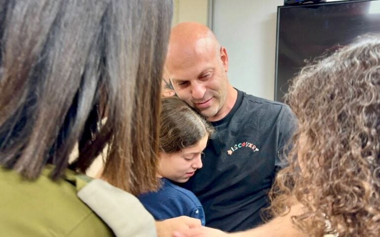 Hila Rotem is embraced by her uncle upon her return to Israel. Her mother, Raya, is still being held captive in the Gaza Strip. Photo courtesy of the IDF Spokesperson’s Unit