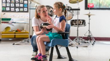 A therapist working with a mobility-challenged child. Photo courtesy of Rifton via the Malki Foundation